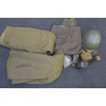 A quantity of uniforms, Czechoslovakian helmet, Russian military belt, etc.