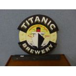 A Titanic Brewery double sided metal and wood sign