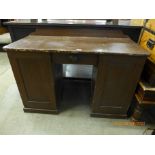 A Victorian stained pine kneehole desk