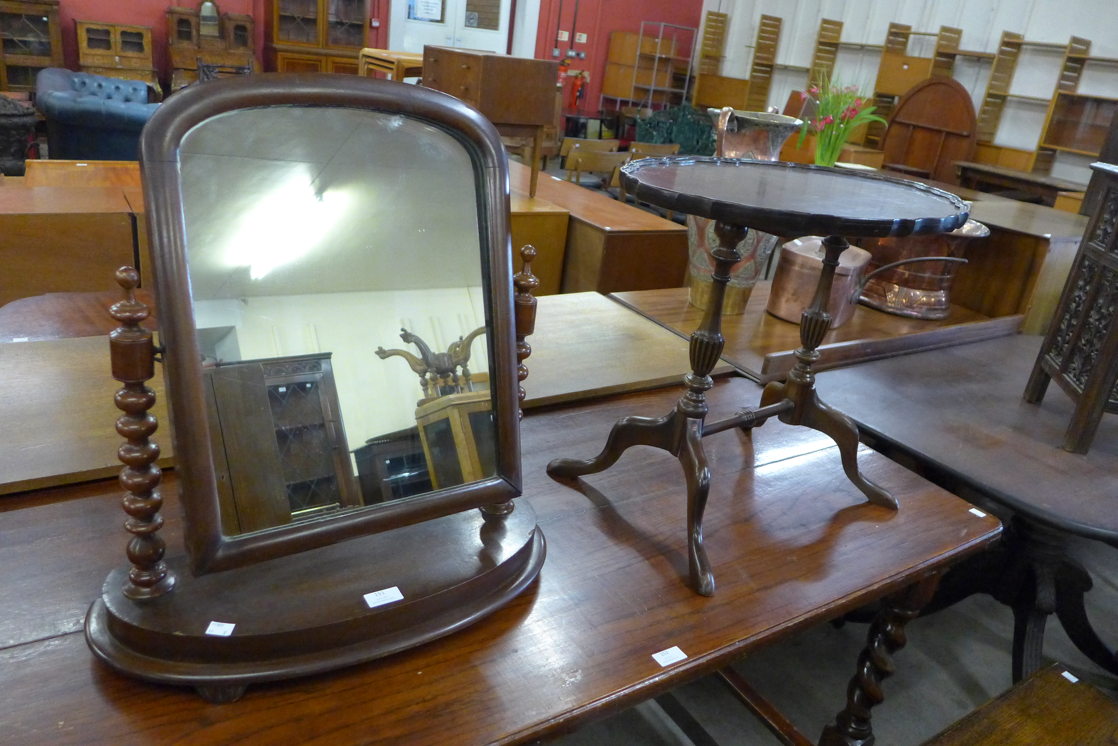 A mahogany toilet mirror and an occasional table