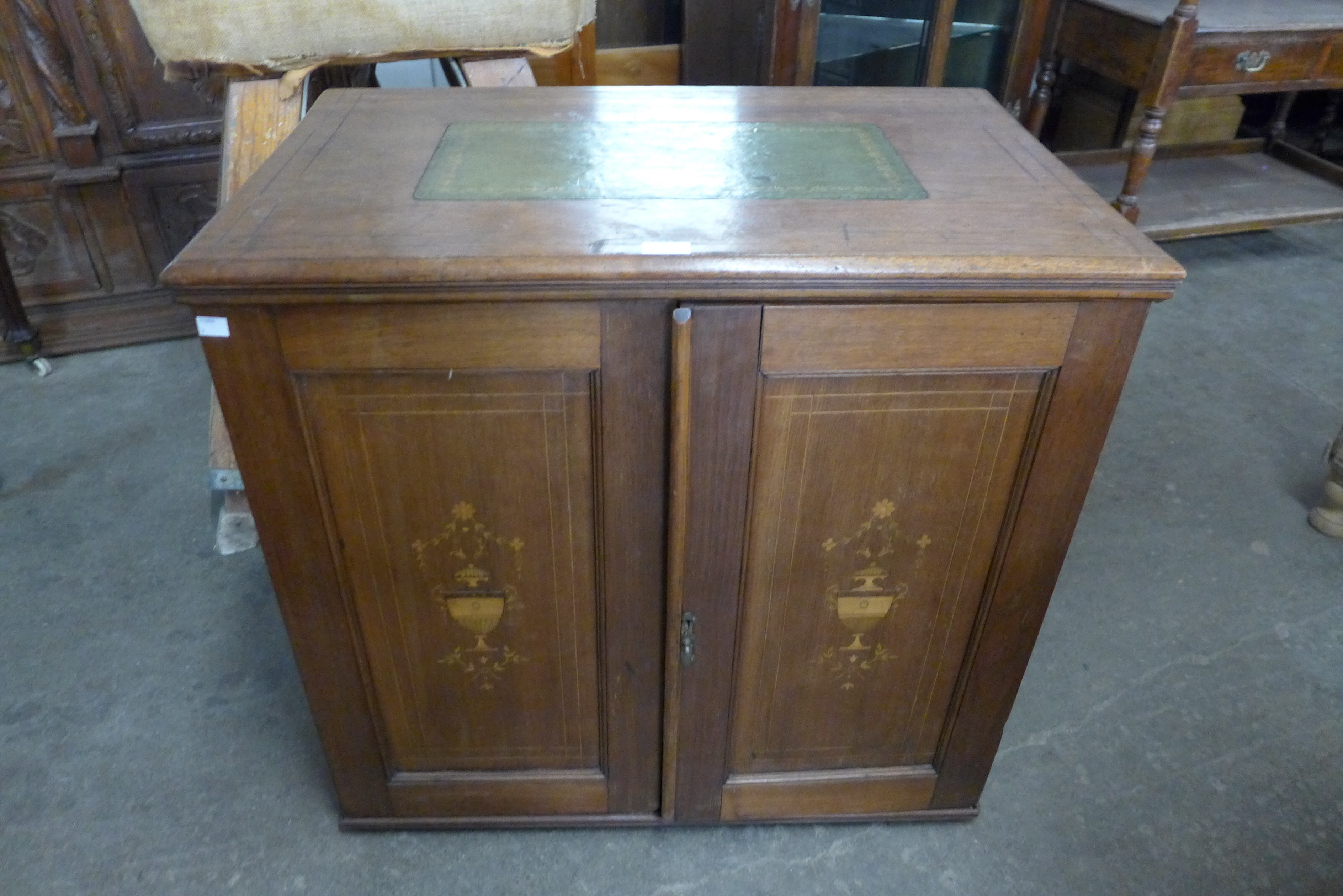 An Edward VII inlaid mahogany fitted two door cupboard