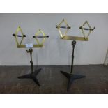 A pair of brass shoe shop stands