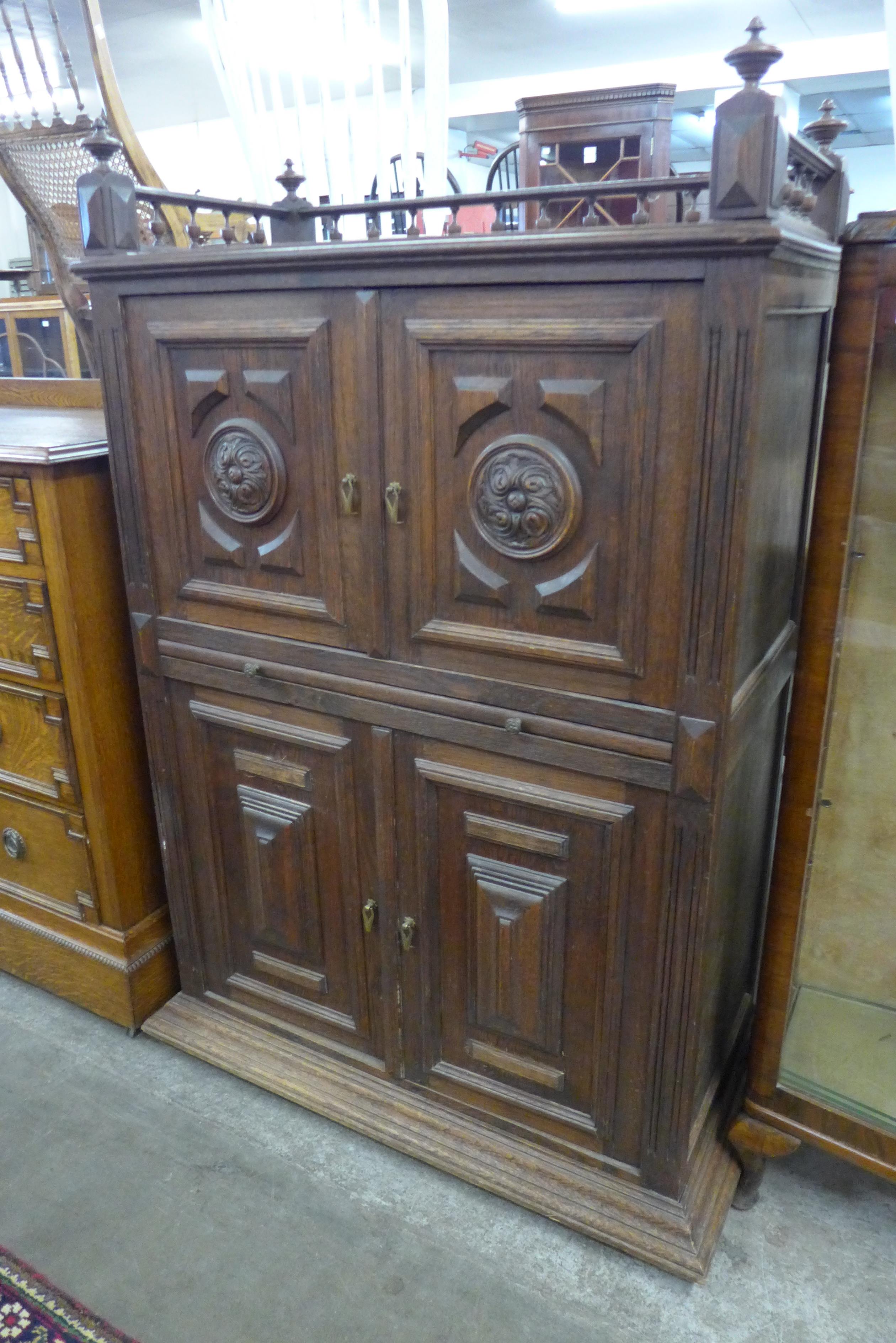 A 19th Century French carved oak four door cupboard