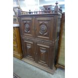 A 19th Century French carved oak four door cupboard