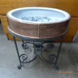 A 19th Century French copper and wrought iron toilet, with blue and white porcelain bowl