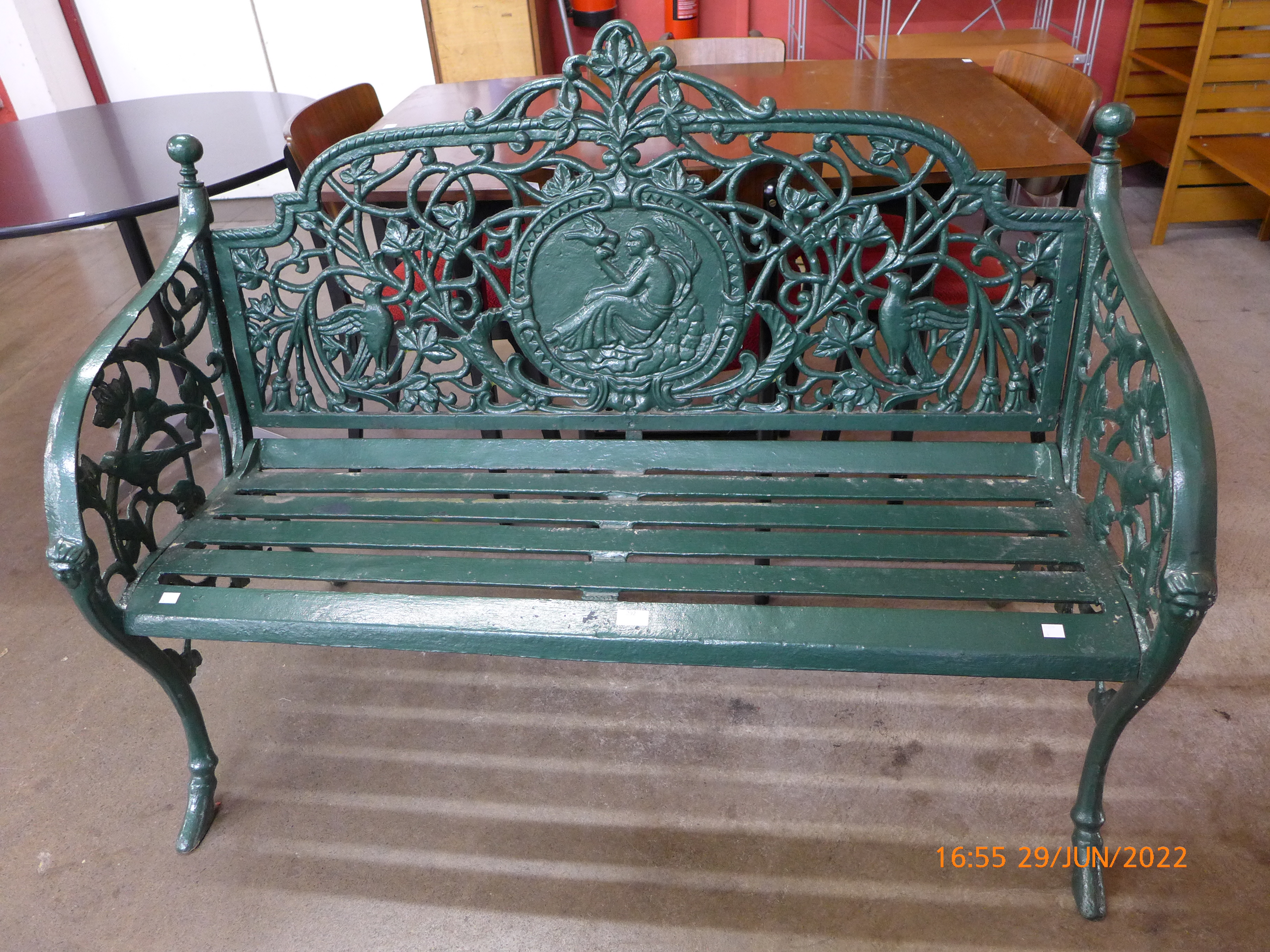 A Victorian style painted cast iron garden bench