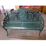 A Victorian style painted cast iron garden bench