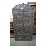 An Indian heavily carved two door shutter