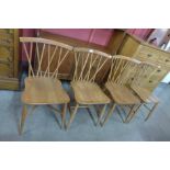 A set of four Ercol Blonde elm and beech Candlestick Lattice dining chairs