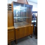 A Turnidge teak display cabinet