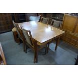 A Nathan teak extending dining table and four chairs