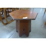 An Arts and Crafts walnut hexagonal occasional table