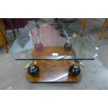 A Maison Charles style walnut effect, brass eagle and glass topped coffee table