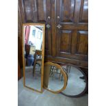 Three teak framed mirrors