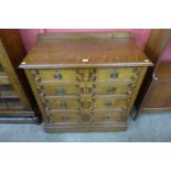 An early 20th Century oak geometric moulded chest of drawers