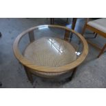 A G-Plan teak, rattan and glass topped circular coffee table