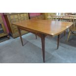 A teak extending dining table