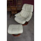 A Norweigan Ekornes beech and cream leather Stressless lounge chair and stool