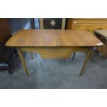 A teak sewing table