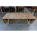 An Erol Blonde elm and beech extending Windsor coffee table