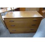 A teak chest of drawers