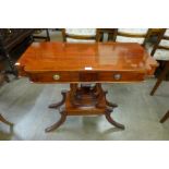 A Regency style mahogany two drawer side table