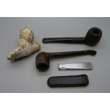 A French Jacob clay pipe bowl, two other pipes and a tamper