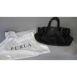 A lady's Furla leather handbag