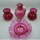 A pair of cranberry glass vases, bowl and one other vase