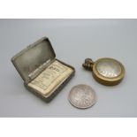 A U.S. 1888 one dollar coin, a snuff box and a lighter