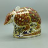 A Royal Crown Derby paperweight, Armadillo, gold stopper and red Royal Crown Derby stamp on the base