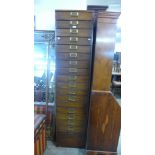 An oak eighteen drawer filing cabinet