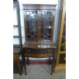 An Edward VII Chippendale Revival mahogany side cabinet, with carved blind fret decoration