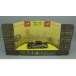 A Corgi Toys Bentley Continental Sports Saloon die-cast model vehicle with shop display card