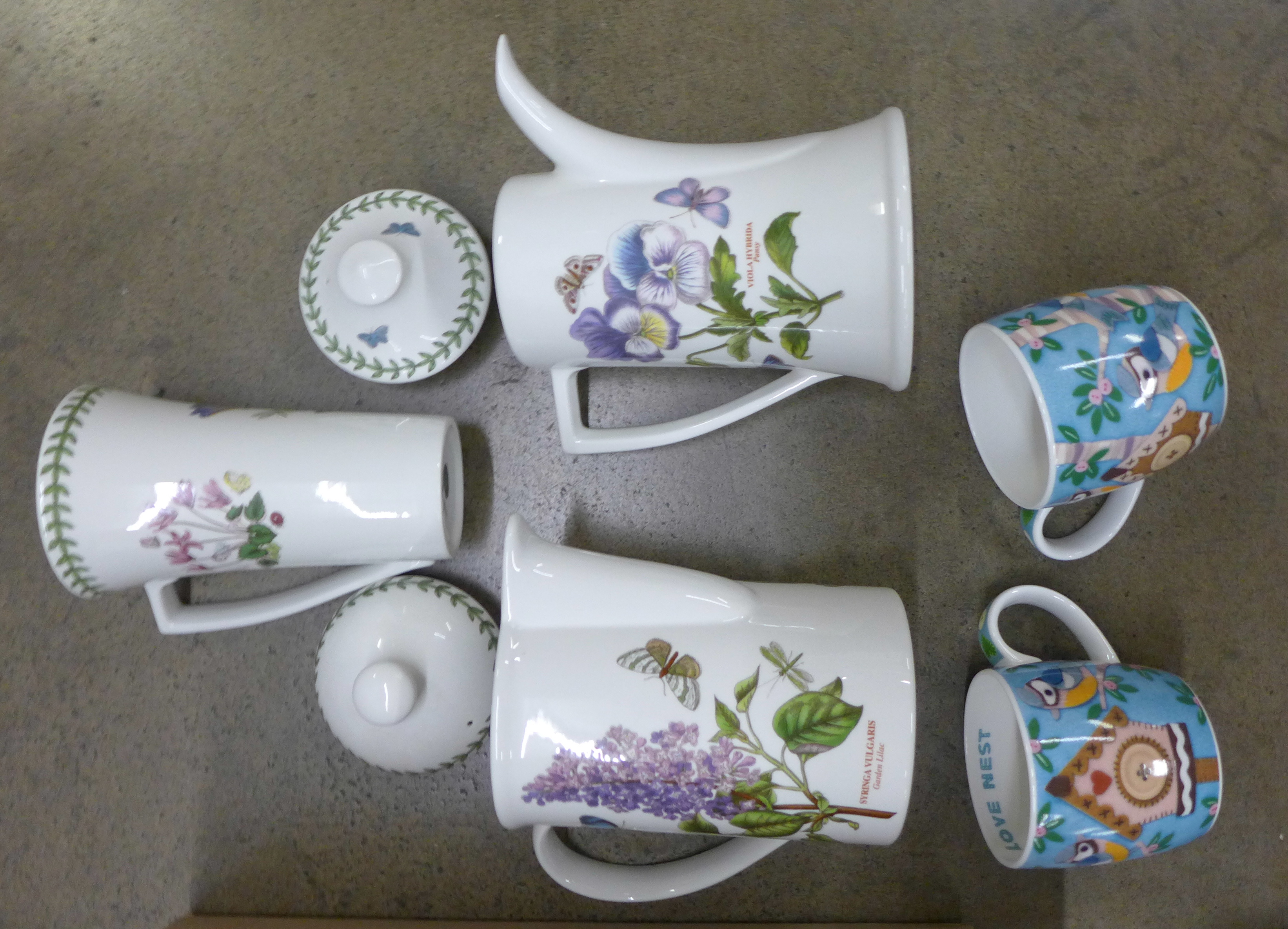 Five Portmeirion Botanic Garden teapots and coffee pots and a box of various mugs and Royal