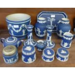 Adams and Wedgwood dark blue Jasperware; a pair of candlesticks, jardinière, pair of vases, etc.,