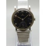 A 1950's Omega wristwatch with black dial and sub dial second hand, manual wind, 31mm case