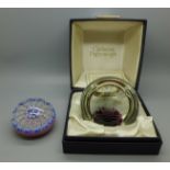 A Caithness glass paperweight, boxed and one other Millefiori glass paperweight