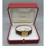 A silver gilt cased must de Cartier tank wristwatch, in box with papers, 24mm case