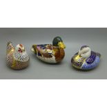 Three Royal Crown Derby paperweights, two Ducks, one gold and one silver stopper and Hen with gold