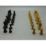 An early 20th Century carved chess set, boxed, height of king 5.3cm