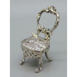 A silver miniature dolls house chair, London import marks for 1895