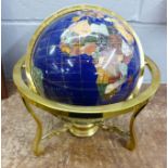 A gem set inlaid globe on brass stand