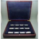 A cased set of twelve silver ingots, Palaces of Great Britain, 381.5g, marked on the rims