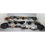 A collection of wristwatches including Tommy Hilfiger, Casio, Armani Exchange, Invicta, etc.