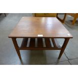 A teak square coffee table