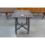 A Victorian carved oak jardiniere stand