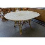 A bamboo and rattan oval dining table