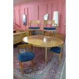 A Nathan teak extending dining table and six chairs