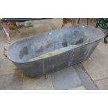 A galvanised slipper bath